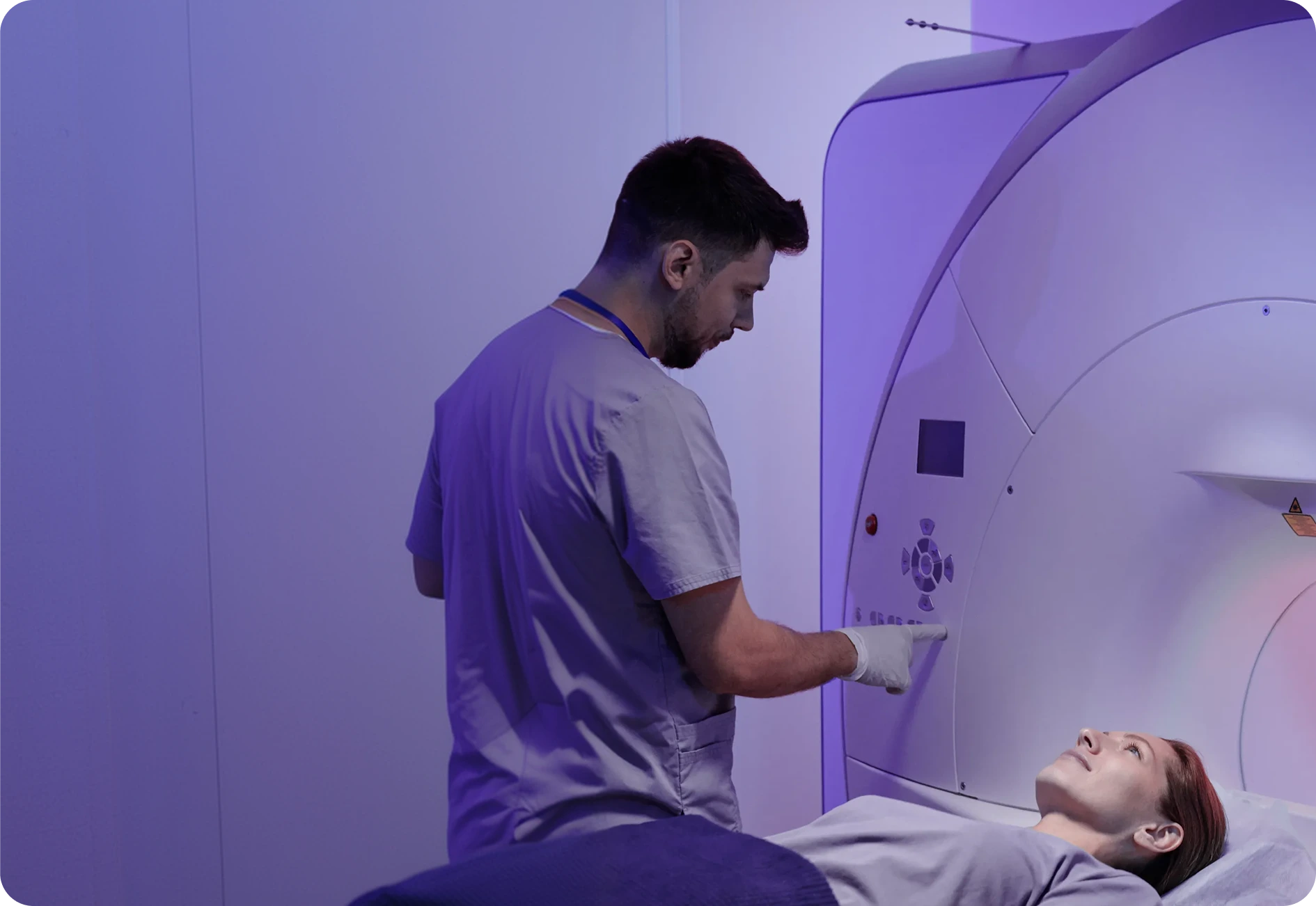 Bright Radiology Practitioner assisting patient in modern MRI facility